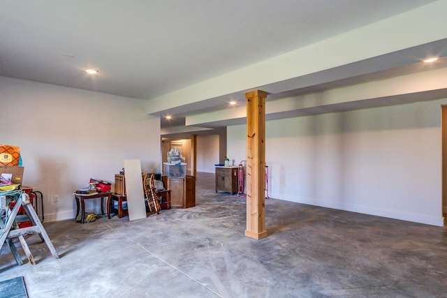 finished basement featuring baseboards and recessed lighting