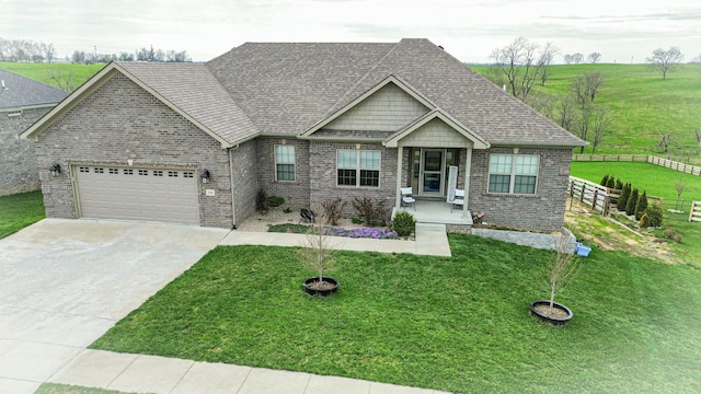 view of front of home featuring brick siding, a garage, driveway, and roof with shingles
