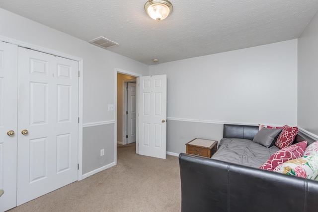 carpeted bedroom with baseboards