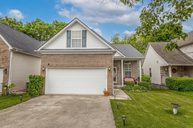 traditional-style home with driveway, brick siding, a front yard, and covered porch