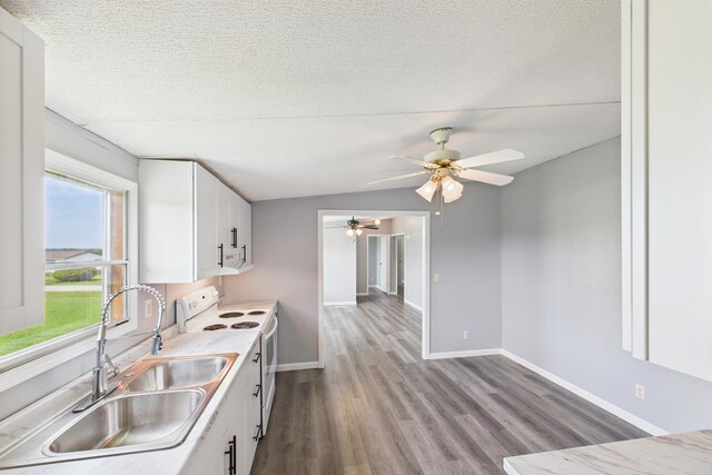 599 Ravenwood Ests, London, KY 40741 - kitchen with electric stove, a sink, wood finished floors, white cabinets, and a ceiling fan