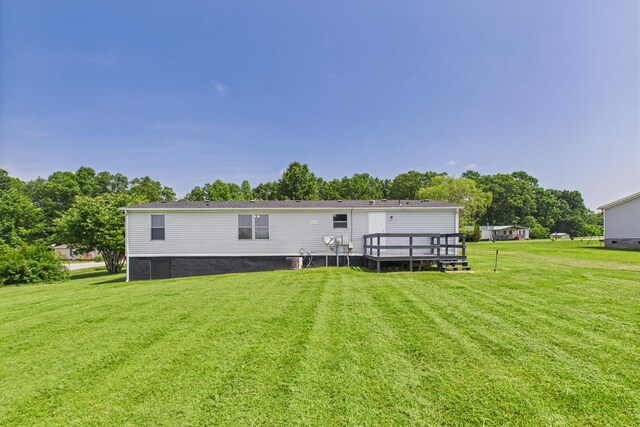 599 Ravenwood Ests, London, KY 40741 - back of property with a yard and a deck
