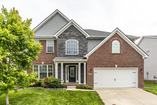 465 Manitoba Ln, Lexington, KY 40515 - traditional home featuring driveway, a front yard, stone siding, and brick siding