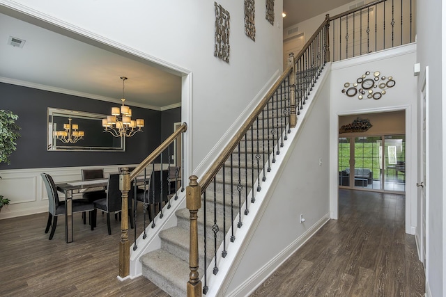 465 Manitoba Ln, Lexington, KY 40515 - stairs with a chandelier, wood finished floors, ornamental molding, a towering ceiling, and baseboards