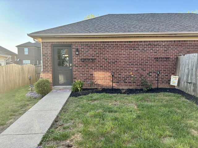 4336 Clearwater Way, Lexington, KY 40515 - doorway to property featuring brick siding and roof with shingles