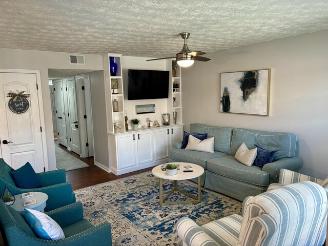 4336 Clearwater Way, Lexington, KY 40515 - living area with dark wood-style floors, a textured ceiling, and a ceiling fan