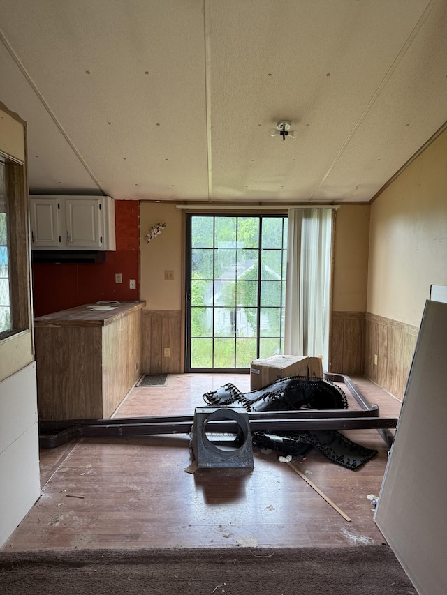 515 Pierce Ln, Frankfort, KY 40601 - kitchen featuring a wainscoted wall, white cabinets, and wooden walls