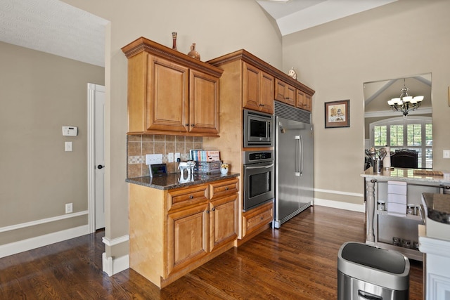 43 Enclave Dr, Somerset, KY 42503 - kitchen featuring built in appliances, dark wood-type flooring, baseboards, tasteful backsplash, and brown cabinetry