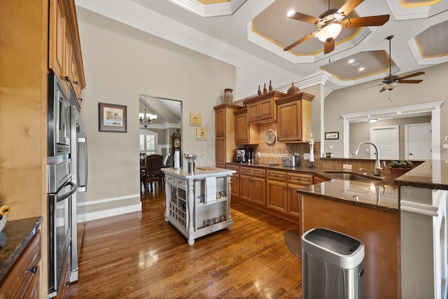 43 Enclave Dr, Somerset, KY 42503 - kitchen with a sink, ceiling fan, open shelves, brown cabinetry, and appliances with stainless steel finishes