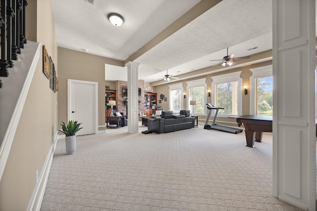 43 Enclave Dr, Somerset, KY 42503 - living area with ornate columns, carpet floors, a textured ceiling, ceiling fan, and baseboards