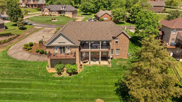43 Enclave Dr, Somerset, KY 42503 - back of house with a balcony, brick siding, a residential view, and a lawn