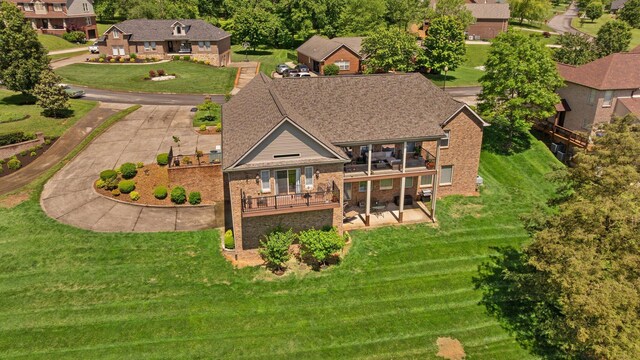 43 Enclave Dr, Somerset, KY 42503 - rear view of house with a balcony, brick siding, a patio area, and a yard