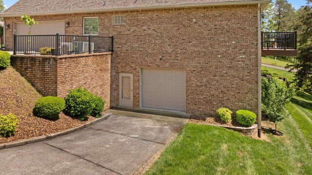 43 Enclave Dr, Somerset, KY 42503 - view of front facade featuring a garage, brick siding, a front lawn, concrete driveway, and a shingled roof