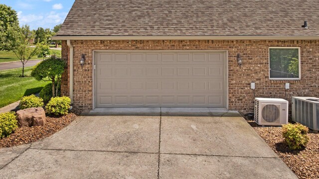 43 Enclave Dr, Somerset, KY 42503 - garage with concrete driveway, ac unit, and central air condition unit