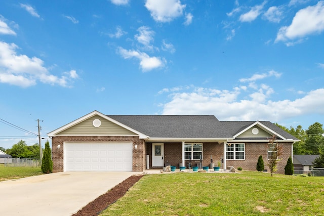 350 Misty Dr, Somerset, KY 42503 - view of front facade featuring brick siding, an attached garage, concrete driveway, roof with shingles, and a porch