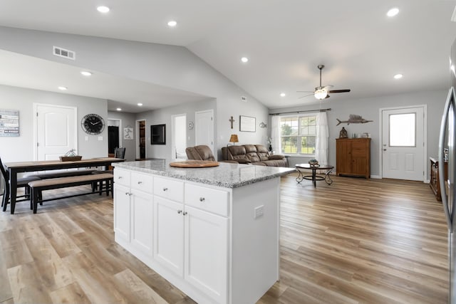 350 Misty Dr, Somerset, KY 42503 - kitchen featuring lofted ceiling, a center island, ceiling fan, white cabinets, and light stone counters