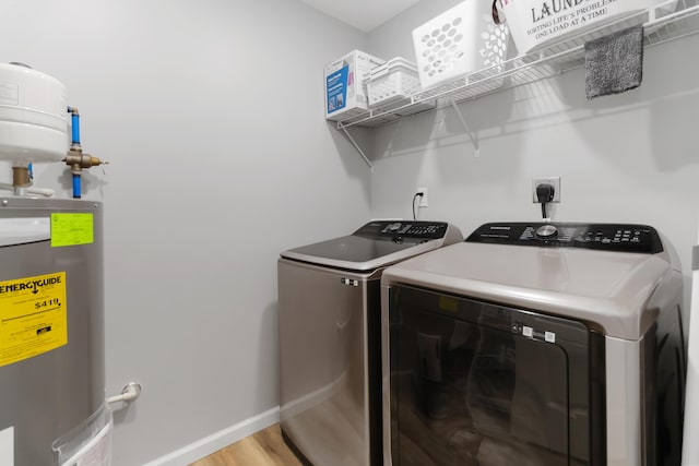 350 Misty Dr, Somerset, KY 42503 - washroom featuring water heater, independent washer and dryer, baseboards, and light wood finished floors