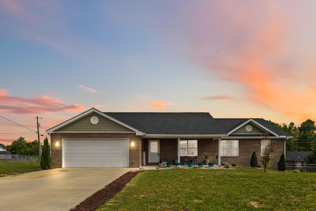350 Misty Dr, Somerset, KY 42503 - view of front facade featuring an attached garage, brick siding, and driveway
