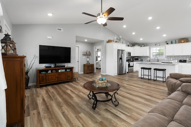 350 Misty Dr, Somerset, KY 42503 - living room with a ceiling fan, recessed lighting, light wood-style flooring, baseboards, and high vaulted ceiling