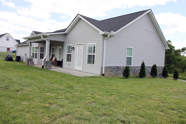156 Kaydons Way, Somerset, KY 42503 - back of house featuring a patio area, a yard, roof with shingles, and central air condition unit