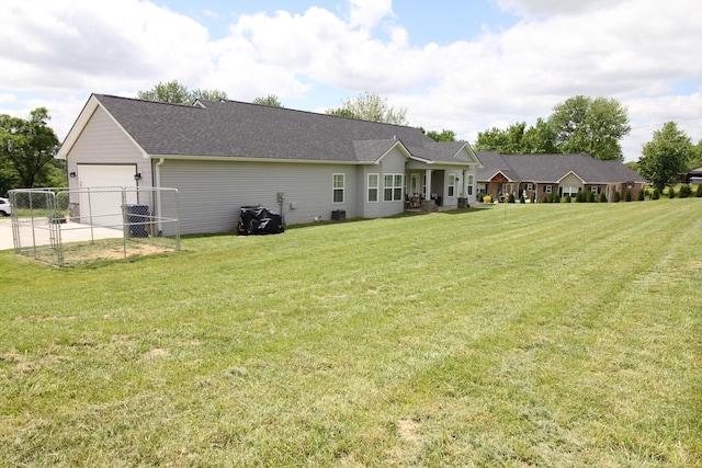 156 Kaydons Way, Somerset, KY 42503 - back of property featuring driveway, roof with shingles, and an attached garage