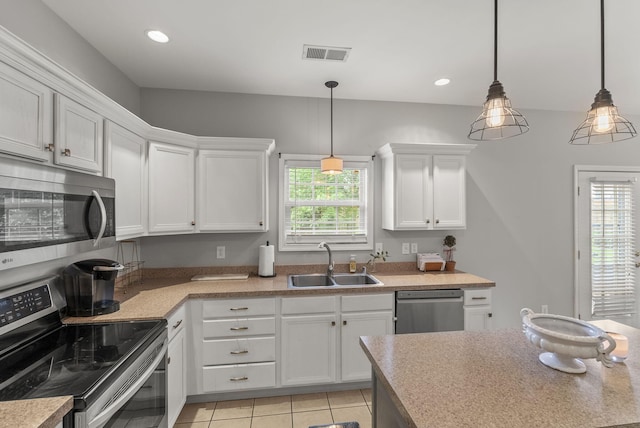 505 Whitfield Dr, Lexington, KY 40515 - kitchen featuring stainless steel appliances, a sink, white cabinetry, light countertops, and light tile patterned flooring