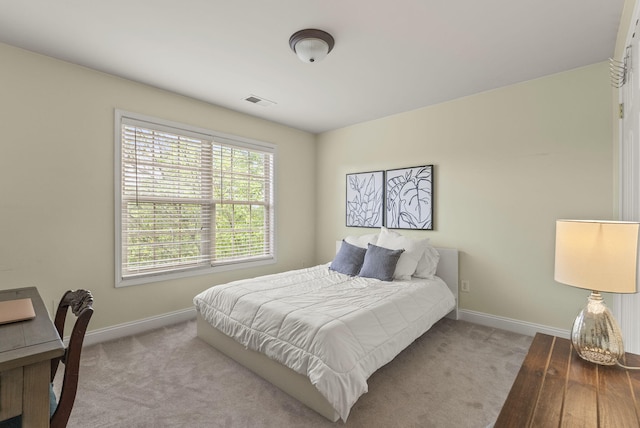 carpeted bedroom with baseboards