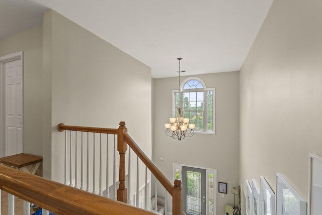 foyer entrance with a chandelier