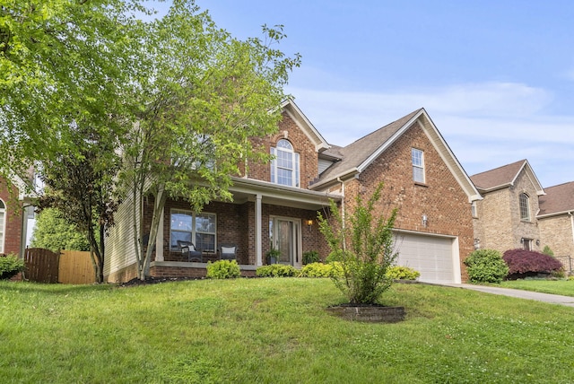 traditional home featuring brick siding, a garage, covered porch, and concrete driveway
