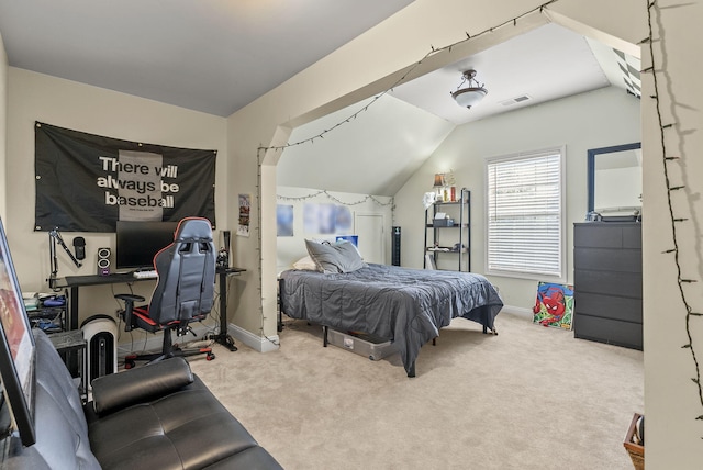 bedroom featuring lofted ceiling, baseboards, and carpet flooring