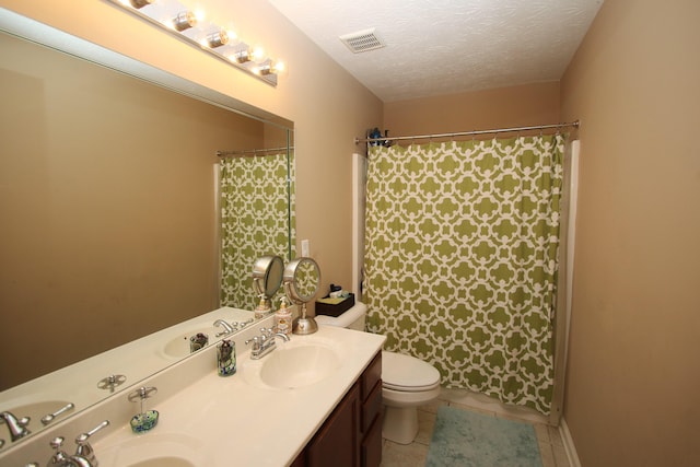 2812 Jenna Rst, Lexington, KY 40511 - full bath featuring toilet, double vanity, tile patterned floors, curtained shower, and a textured ceiling