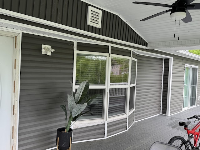 wooden deck featuring ceiling fan