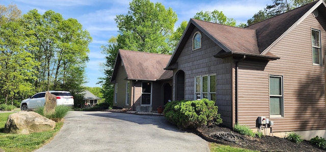 73 Redwood Ln, East Bernstadt, KY 40729 - view of front facade featuring asphalt driveway and a shingled roof
