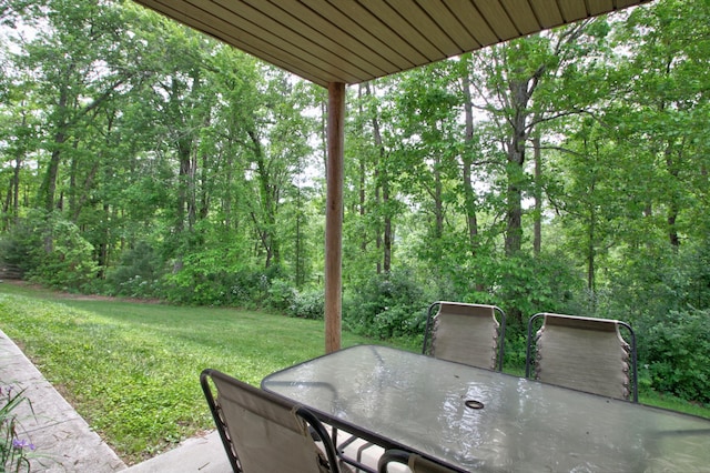 73 Redwood Ln, East Bernstadt, KY 40729 - view of patio with outdoor dining space and a forest view