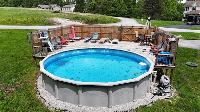 73 Redwood Ln, East Bernstadt, KY 40729 - view of swimming pool featuring a deck and a hot tub