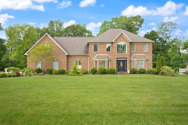 187 Woodside Dr, Somerset, KY 42503 - colonial home with a front lawn, brick siding, and roof with shingles