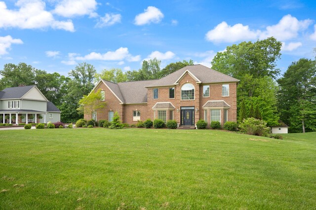 187 Woodside Dr, Somerset, KY 42503 - colonial-style house featuring a front lawn and brick siding
