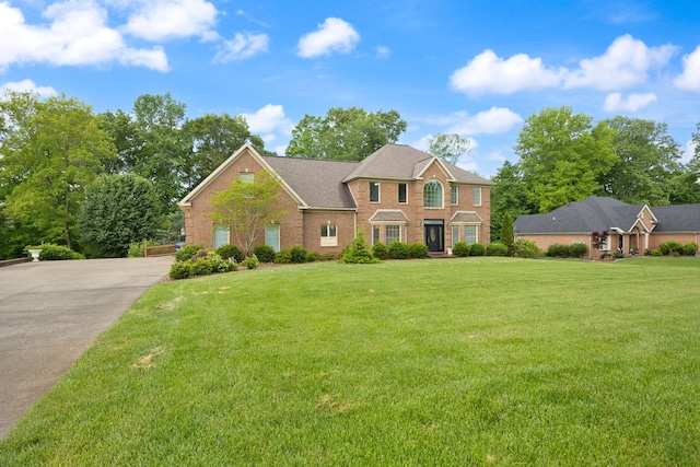 187 Woodside Dr, Somerset, KY 42503 - colonial-style house with brick siding and a front yard