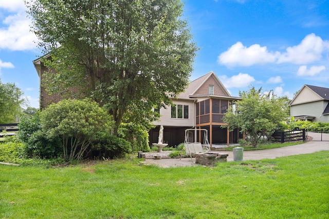 187 Woodside Dr, Somerset, KY 42503 - rear view of property with a sunroom and a yard