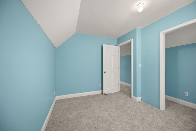 187 Woodside Dr, Somerset, KY 42503 - unfurnished bedroom featuring carpet, baseboards, and vaulted ceiling