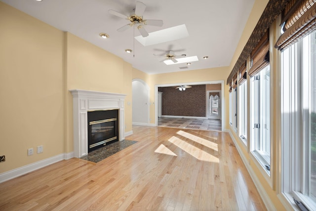 187 Woodside Dr, Somerset, KY 42503 - unfurnished living room with a ceiling fan, plenty of natural light, and light wood finished floors