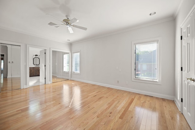 187 Woodside Dr, Somerset, KY 42503 - unfurnished bedroom featuring multiple windows, light wood-style floors, baseboards, ornamental molding, and connected bathroom