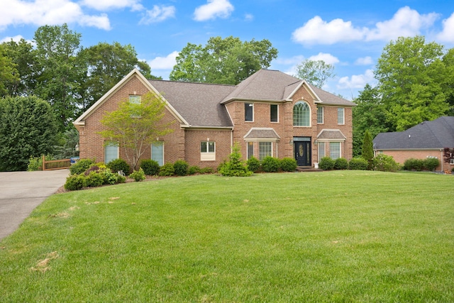 187 Woodside Dr, Somerset, KY 42503 - view of front facade featuring brick siding, a front lawn, and concrete driveway