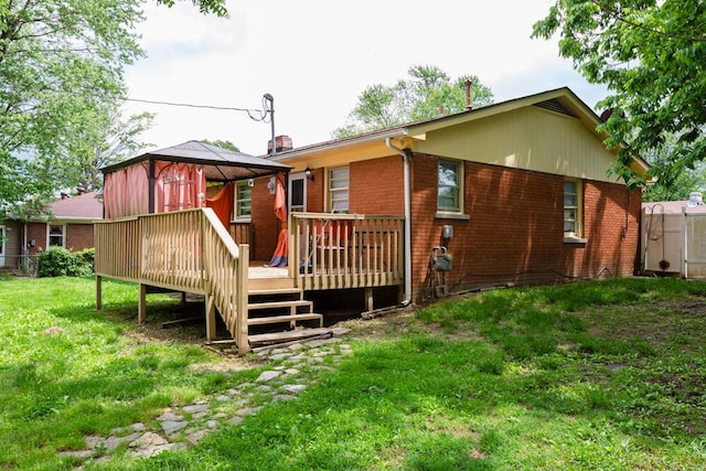 1026 Arapaho Trl, Frankfort, KY 40601 - back of property with a gazebo, brick siding, a deck, and a lawn