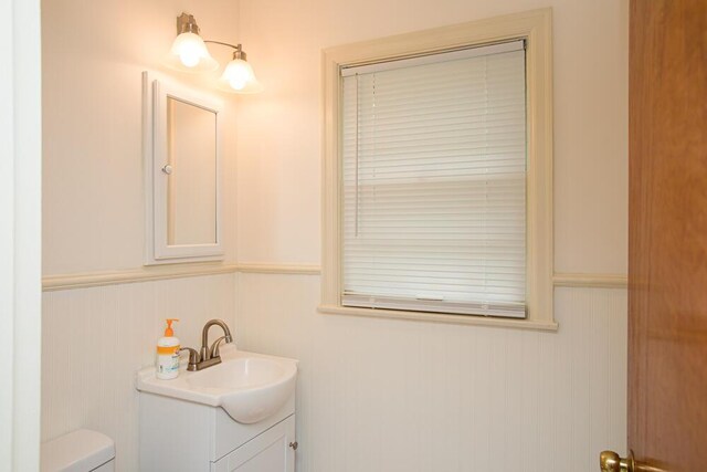 1026 Arapaho Trl, Frankfort, KY 40601 - half bathroom with vanity, toilet, and wainscoting