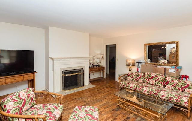 1026 Arapaho Trl, Frankfort, KY 40601 - living area featuring wood finished floors and a fireplace with flush hearth