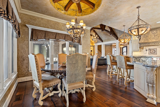 dining area with a chandelier, dark wood-style floors, ornamental molding, and healthy amount of natural light