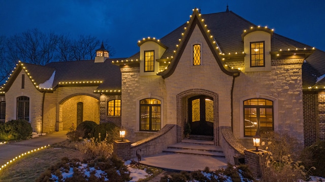 view of front of house featuring stone siding and brick siding