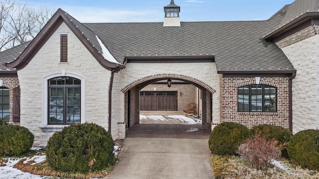 doorway to property with brick siding and stone siding
