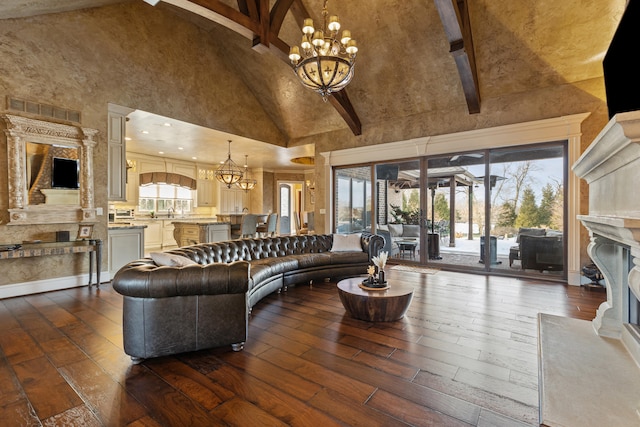 living room with high vaulted ceiling, a fireplace, a chandelier, dark wood-style floors, and beamed ceiling